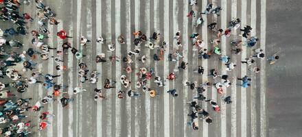 Leadership_People Forming an Arrow High Angle View Of People forming and arrow on the street